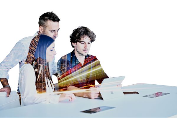 People gathered round a tablet at desk