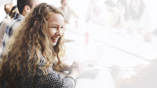 Toyota apprenticeships scheme, girl smiling at a desk