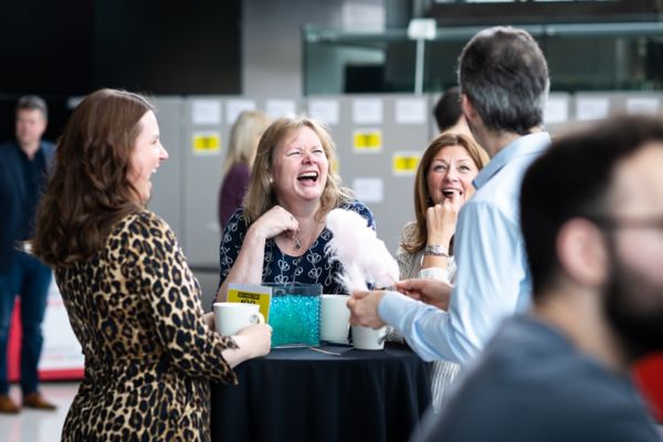 Toyota employees at a table laughing