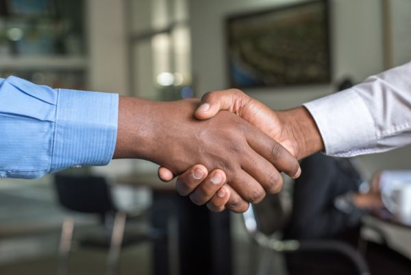 close up of a handshake from Toyota employees