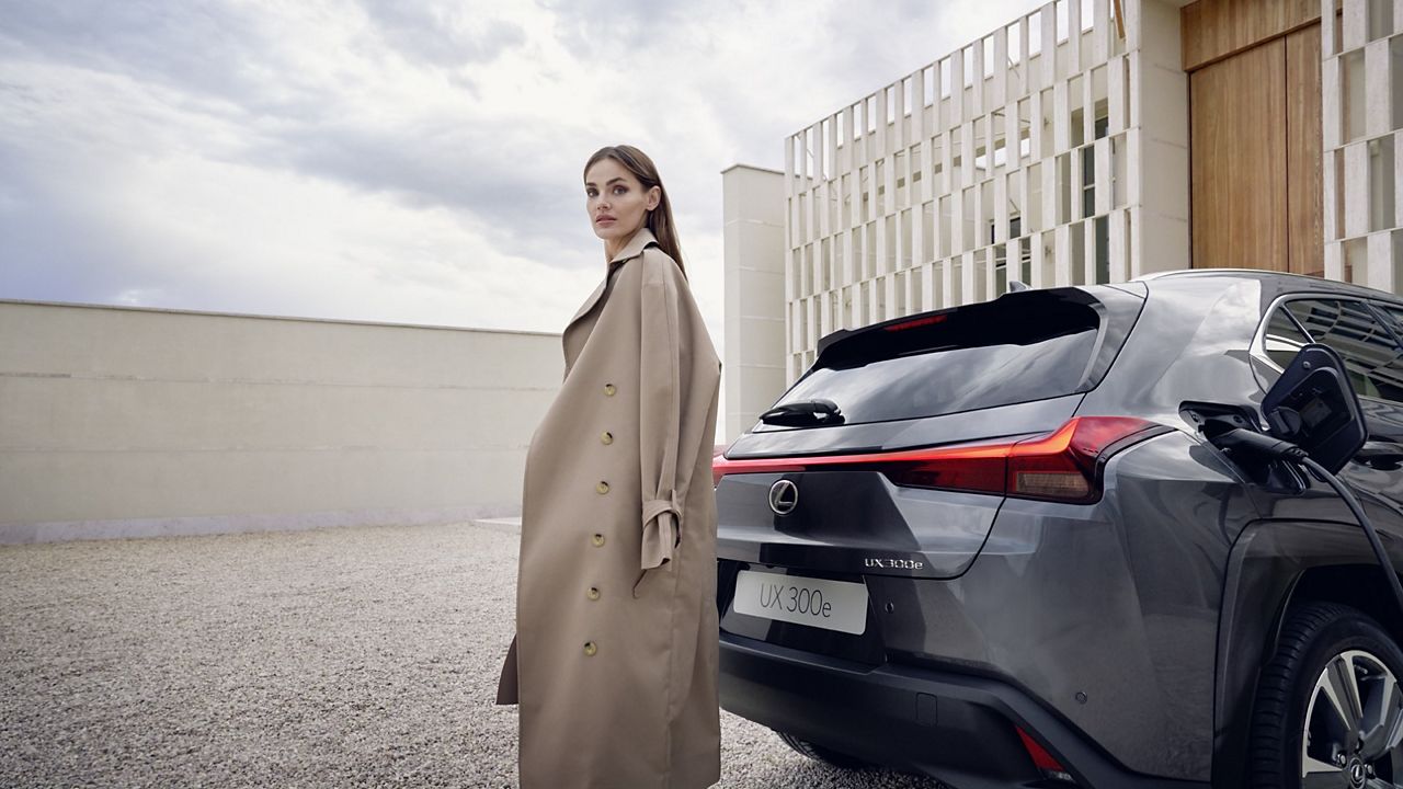 Lexus UX driving through a rural location 