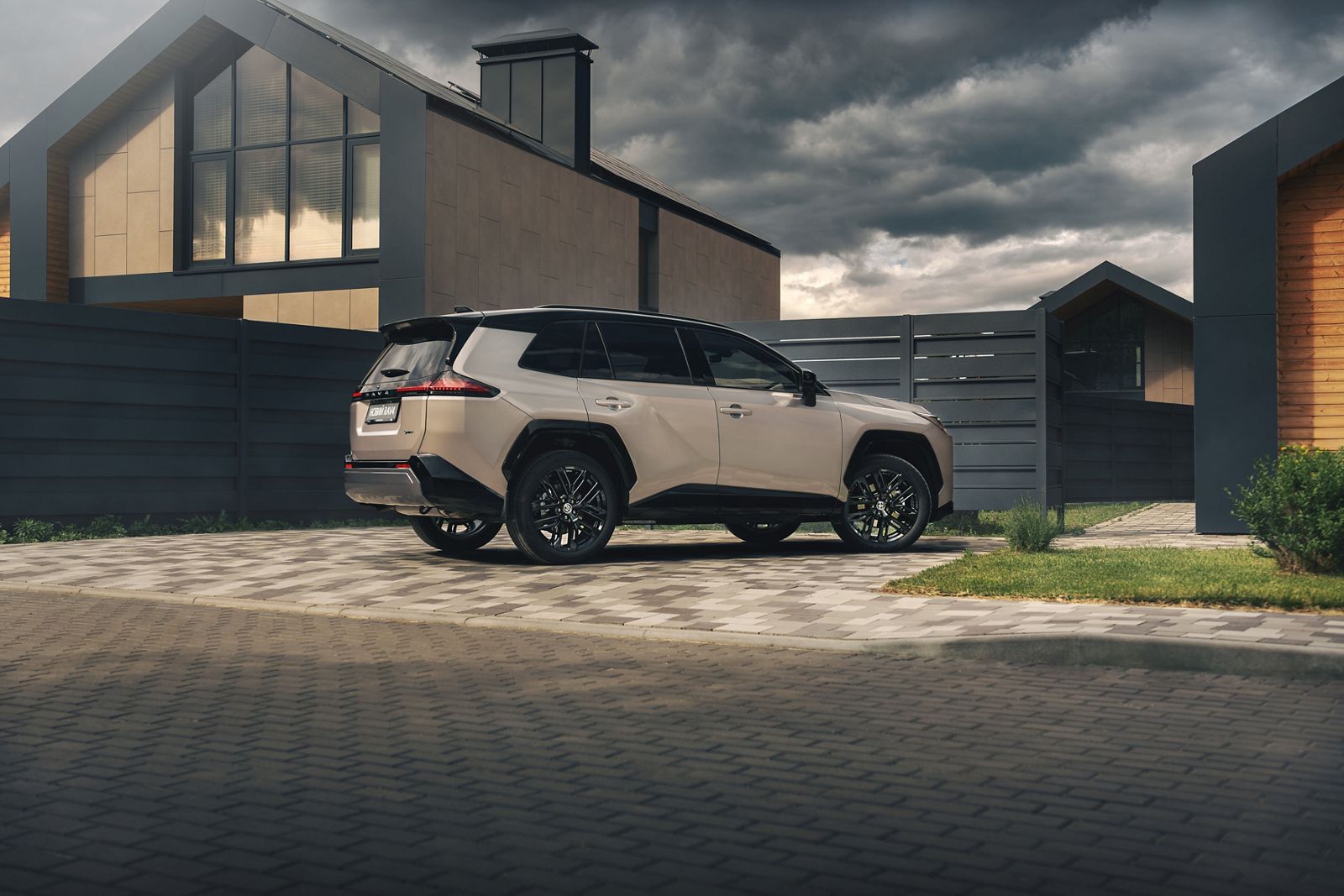 RAV4 driver approaching RAV4 parked outside house