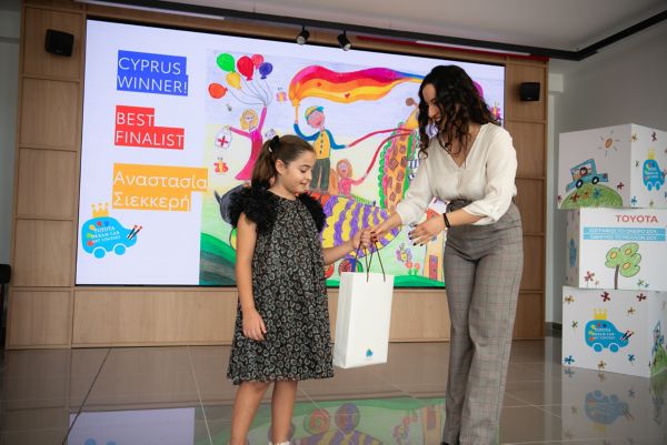 Toyota Dream Car Art Contest 2023 winner receiving a present