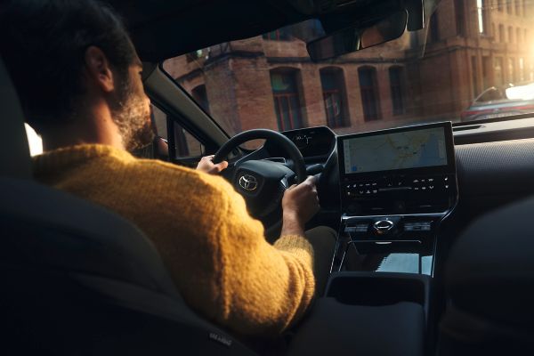 Toyota bZ4X interior with man driving