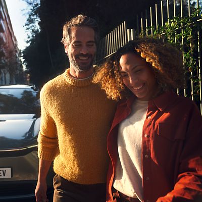 a couple walking away from bZ4X