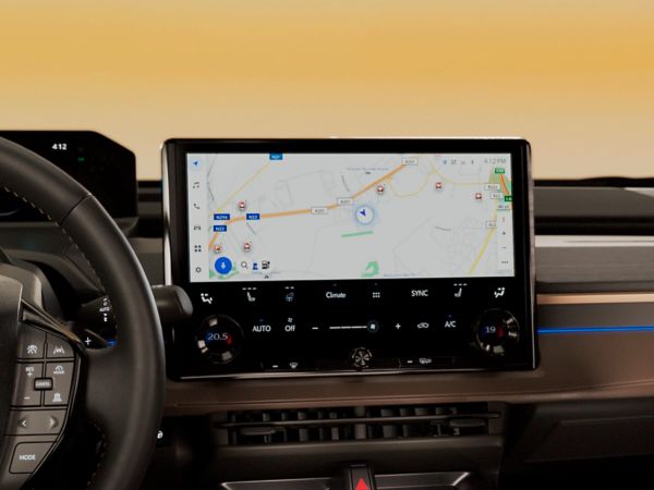 Close up of bZ4X Touring’s large multimedia screen with map of nearby public chargers