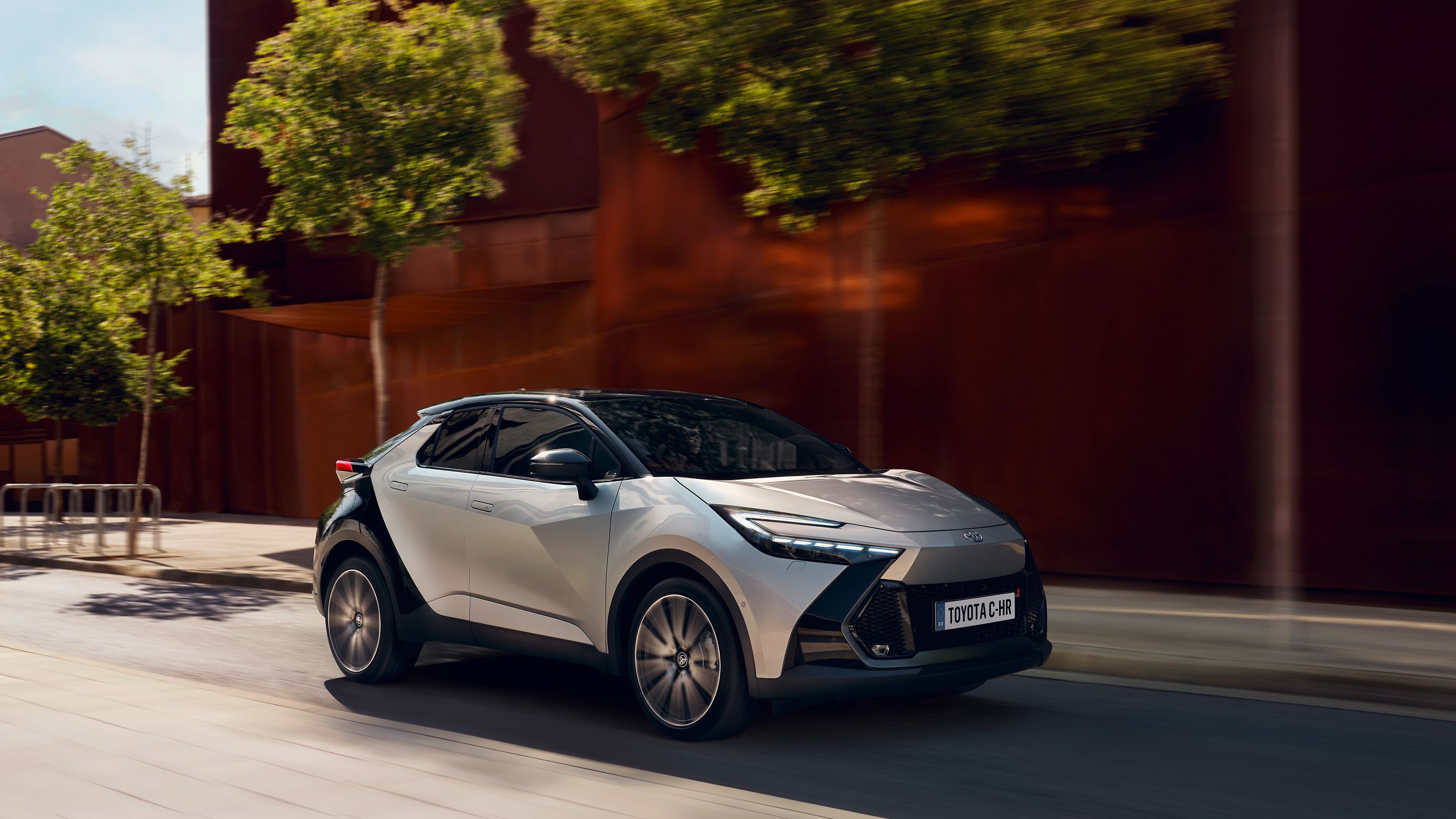 A Toyota C-HR driving true the city
