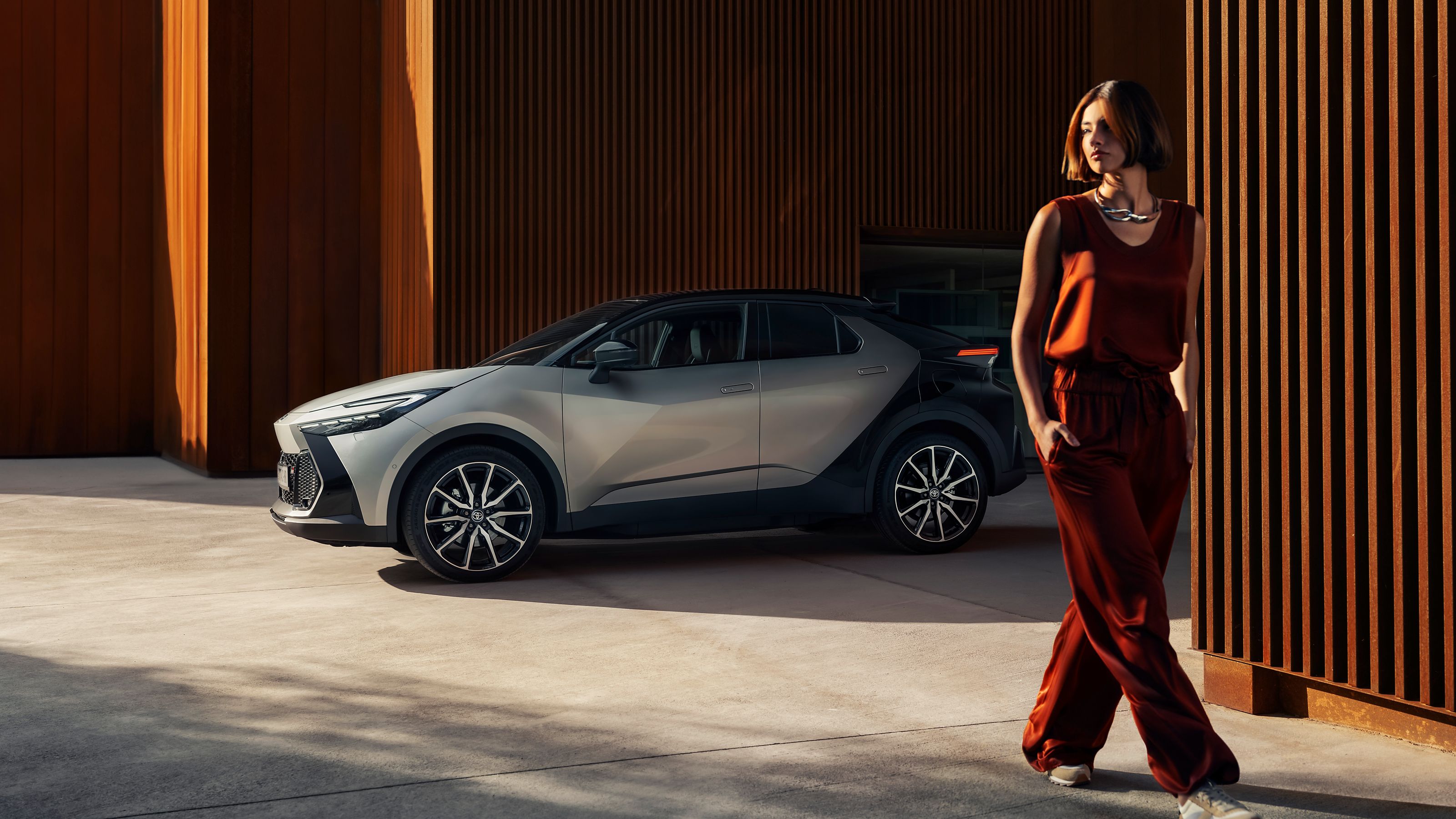 A Toyota C-HR customer walking away from the car