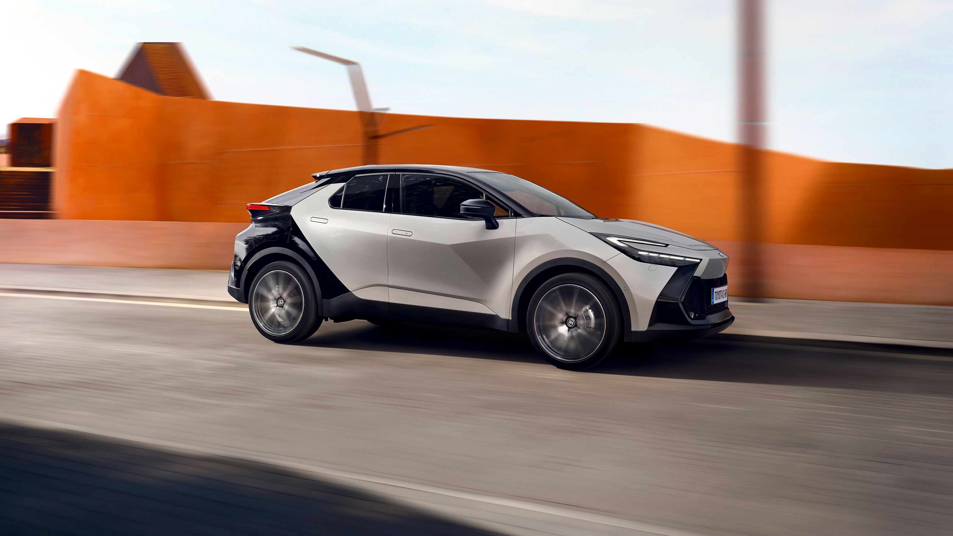 A Toyota C-HR driving true the city