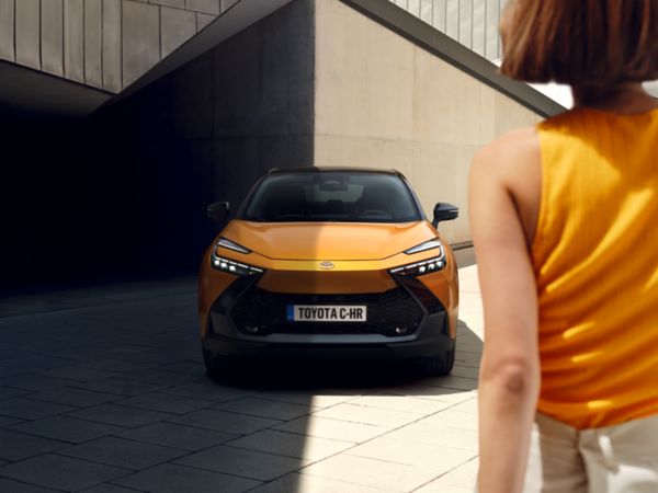 Woman approaching Toyota C-HR