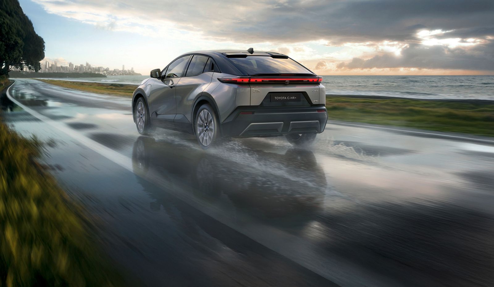 Toyota C-HR+ driving on a country road