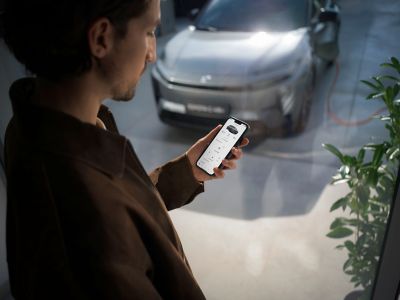 A Toyota owner checking their car status via the MyToyota app