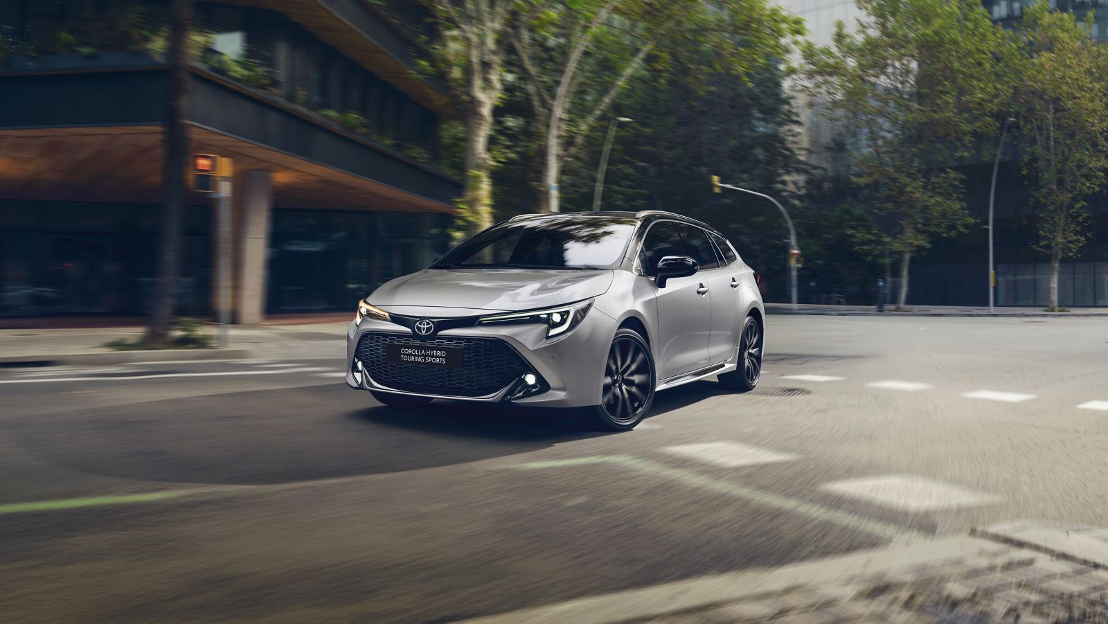 A Corolla driving through a city junction