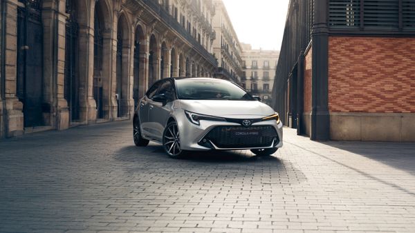 Toyota Yaris Cross driving on road in a forest