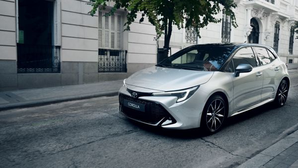 Woman driving Toyota Corolla Hatchback