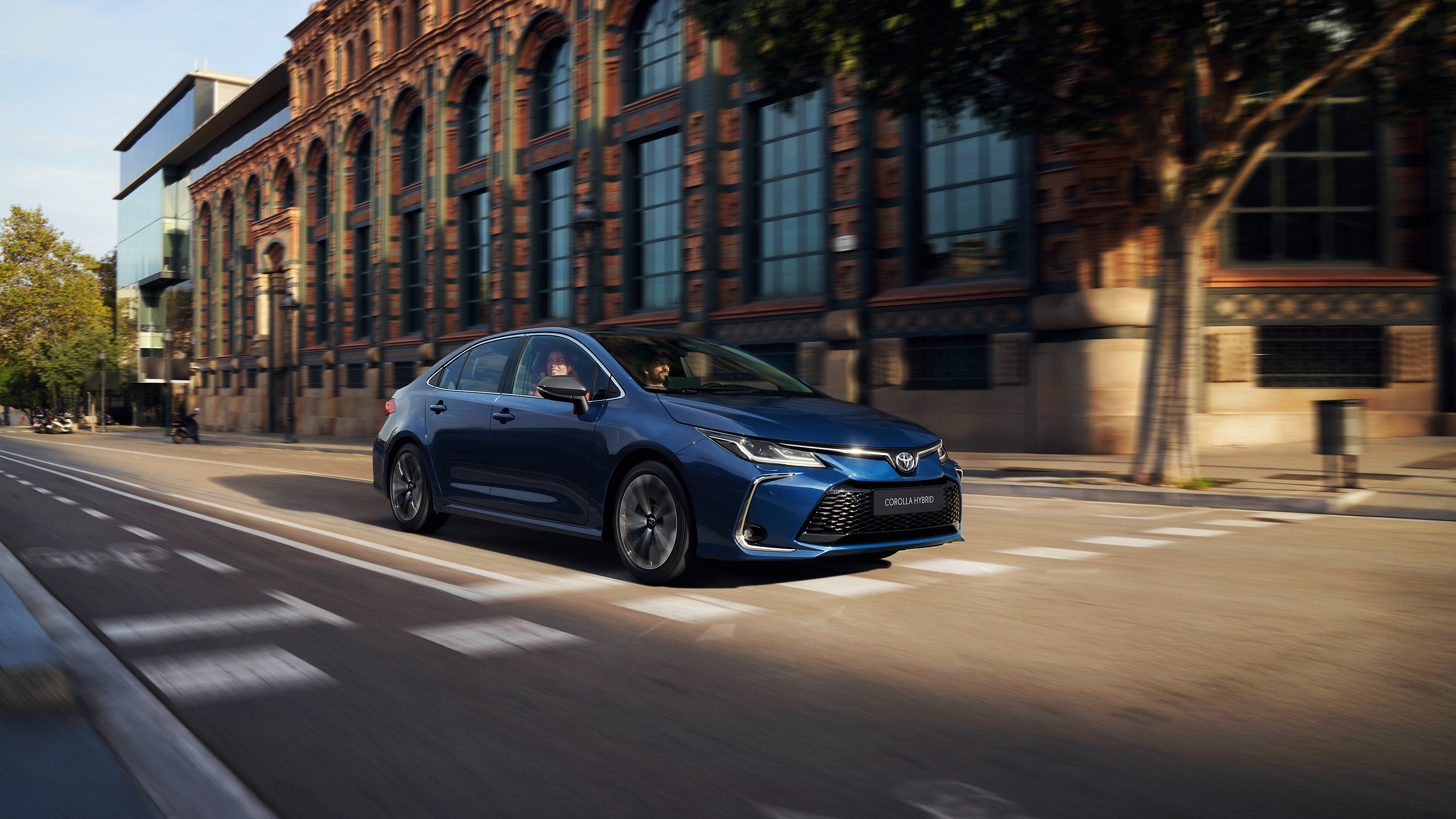Toyota Corolla Sedan cruises through the city