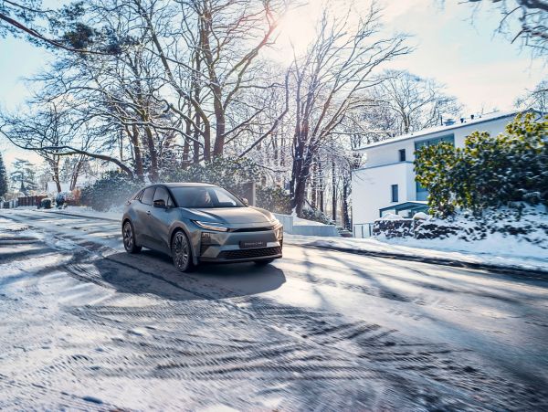 A Toyota C-HR+ on the move in winter