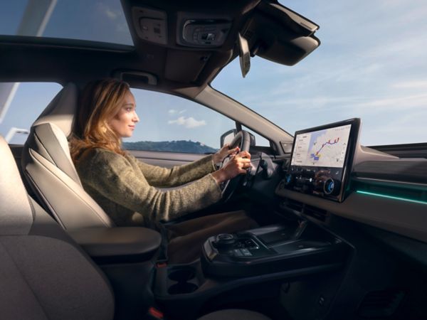 An owner behind the wheel of their Toyota C-HR+