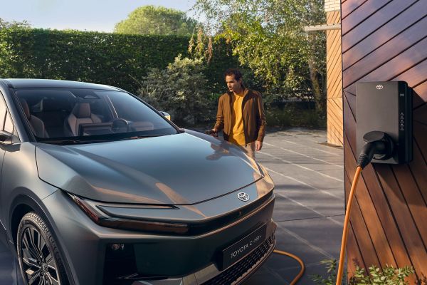 An owner prepares to plug in and charge their Toyota C-HR+
