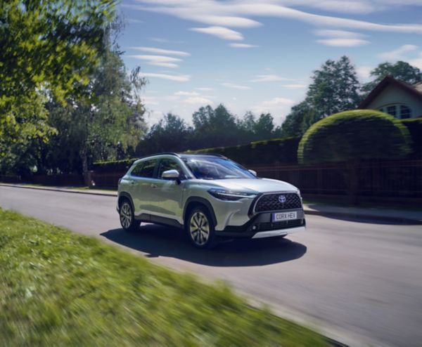A customer pre-conditioning their car’s cabin temperature using the MyToyota app from outside the car