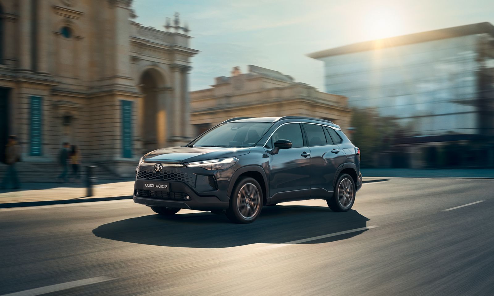 The new Corolla Cross drives along city streets