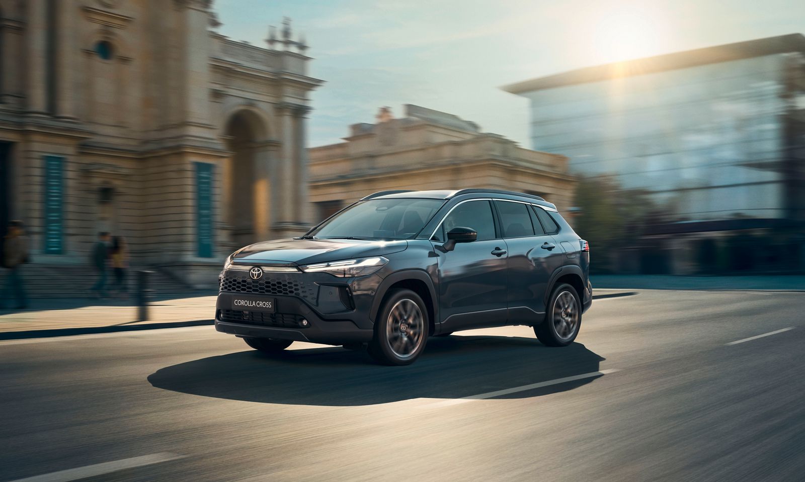 The new Corolla Cross drives along city streets