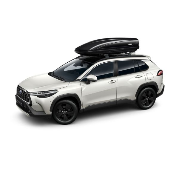 Witte Corolla Cross met zwarte dakkoffer