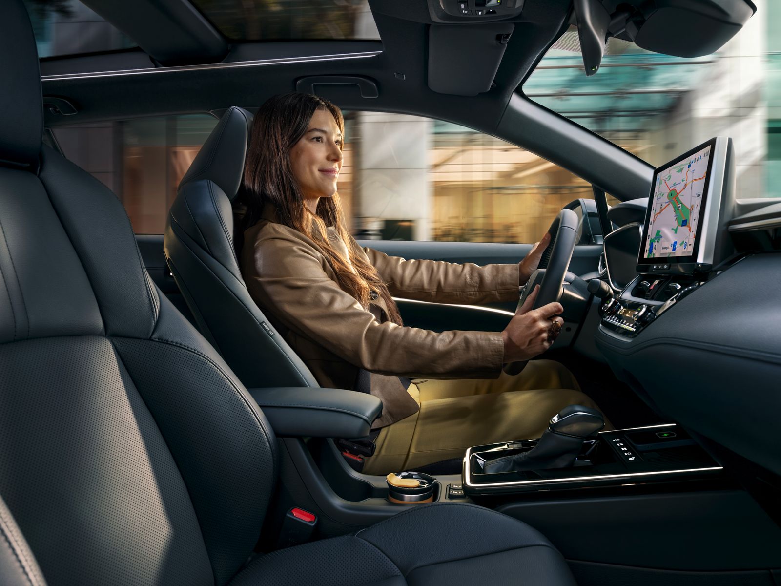 An owner behind the wheel of their Toyota Corolla Cross 