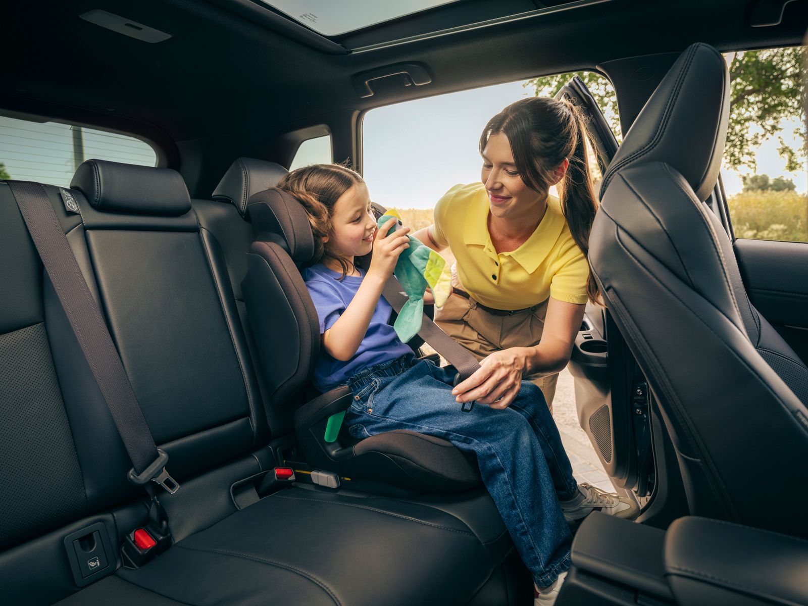 A family with children gets ready for a journey in their Corolla Cross