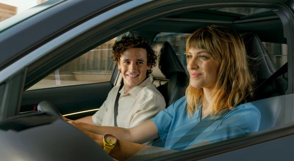 A person driving a Lexus