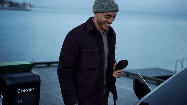 A person charging their car