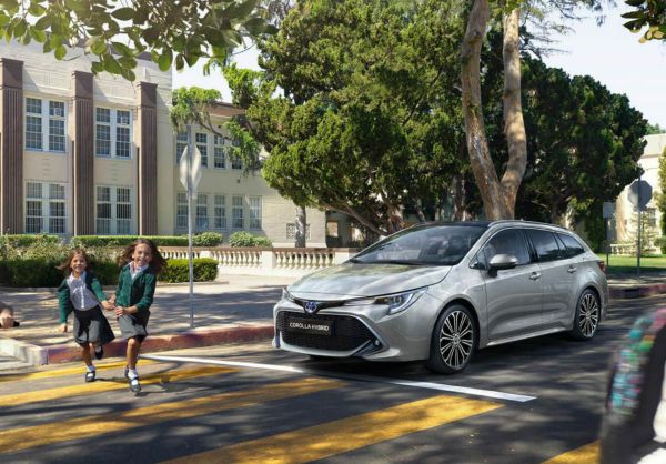 Toyota Corolla Touring Sports stopped at zebra crossing