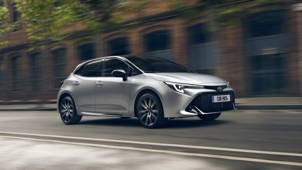 Toyota Corolla Hatchback driving on city road