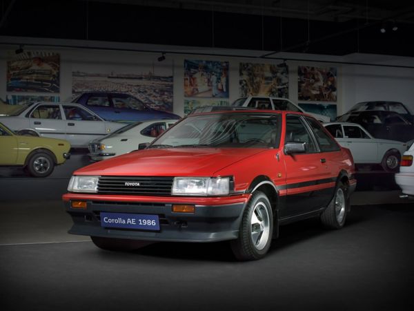 Red Toyota Corolla front angle old style