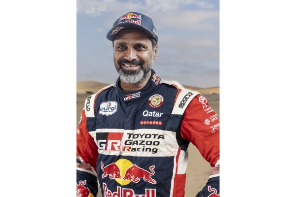 Team 1, Car 200 Driver Nasser Al-Attiyah with hands on hipe smiling to camera