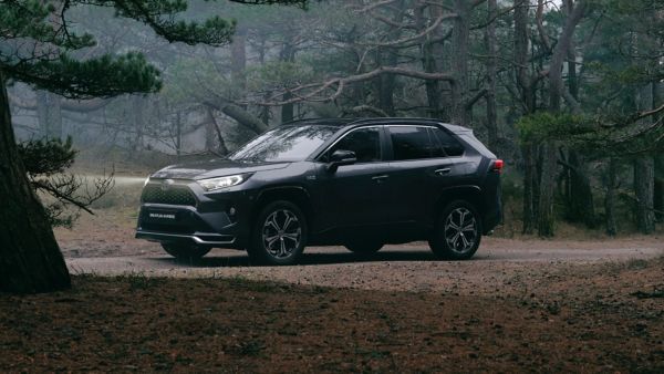 Toyota RAV4 Plugin parked in a woodland