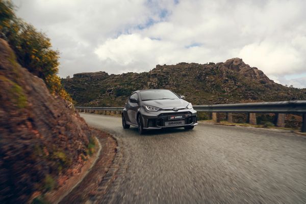 The Toyota GR Yaris drives a mountain road 