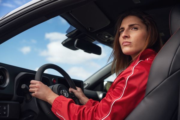 Woman driving Toyota