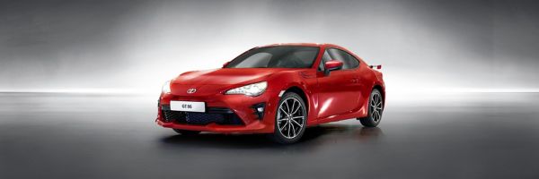 Toyota GT86 in red next to other cars