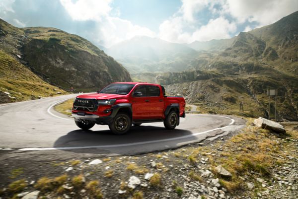 Toyota Hilux driving up a mountain