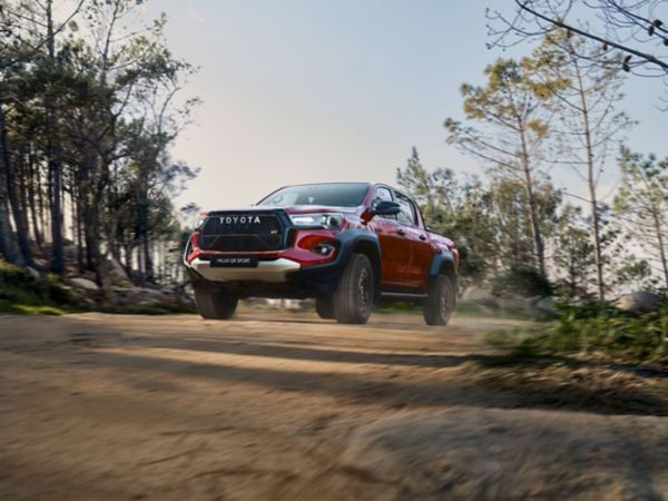 Toyota Hilux GR SPORT II drives a dusty forest track 