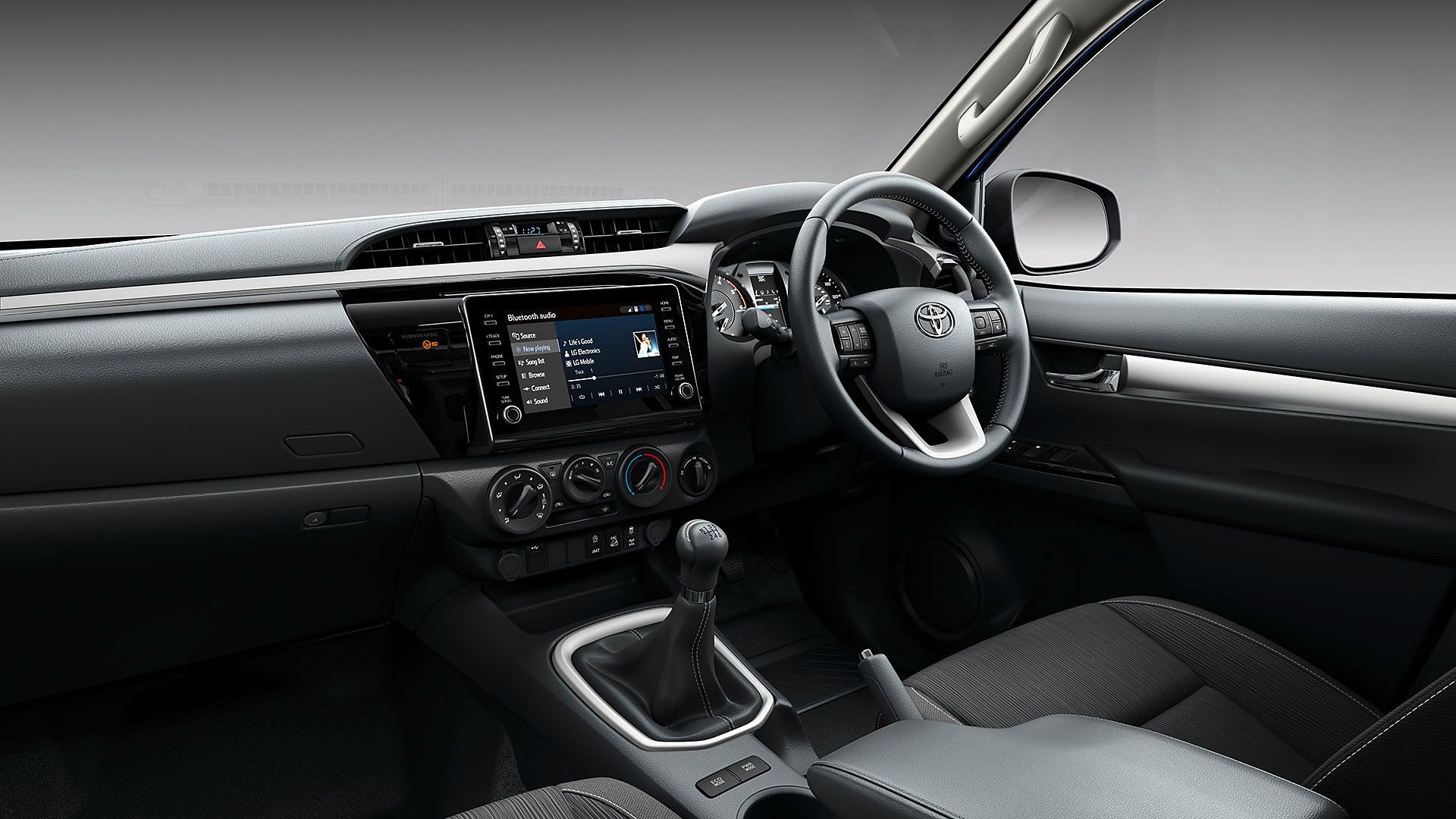 Toyota Hilux front interior multimedia and steering wheel
