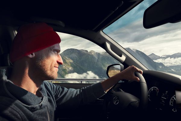 Man driving Toyota Hilux