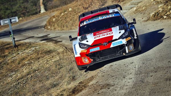 A rally car drifting in snow