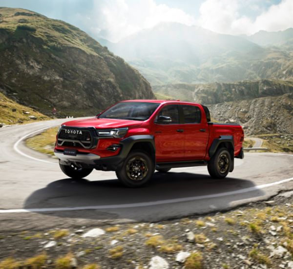 Toyota Hilux driving by the sea