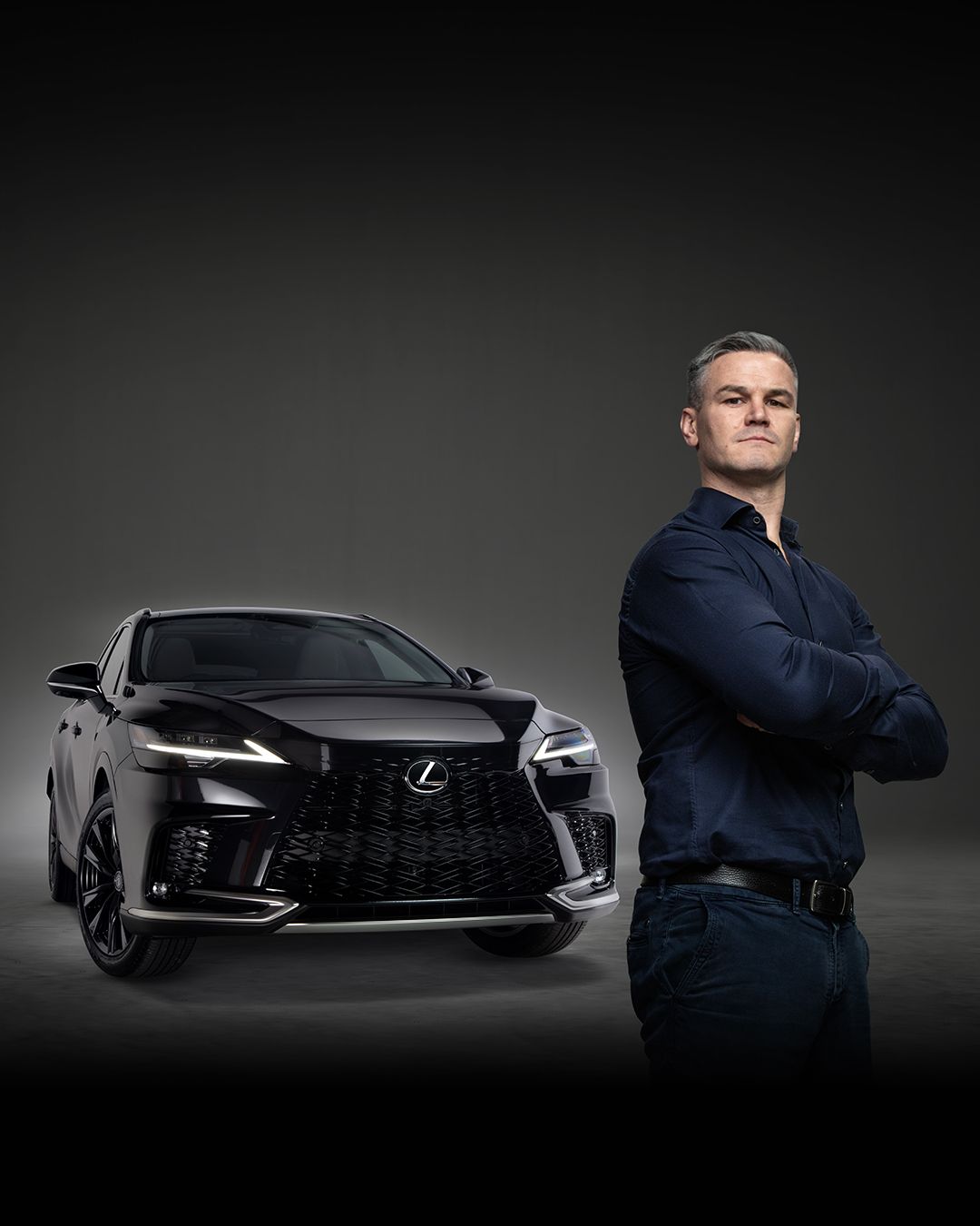 A Lexus NX driving through a winter climate