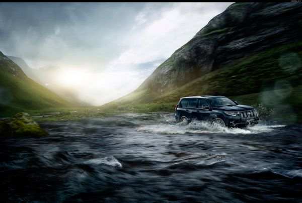 Toyota Land cruiser driving through water