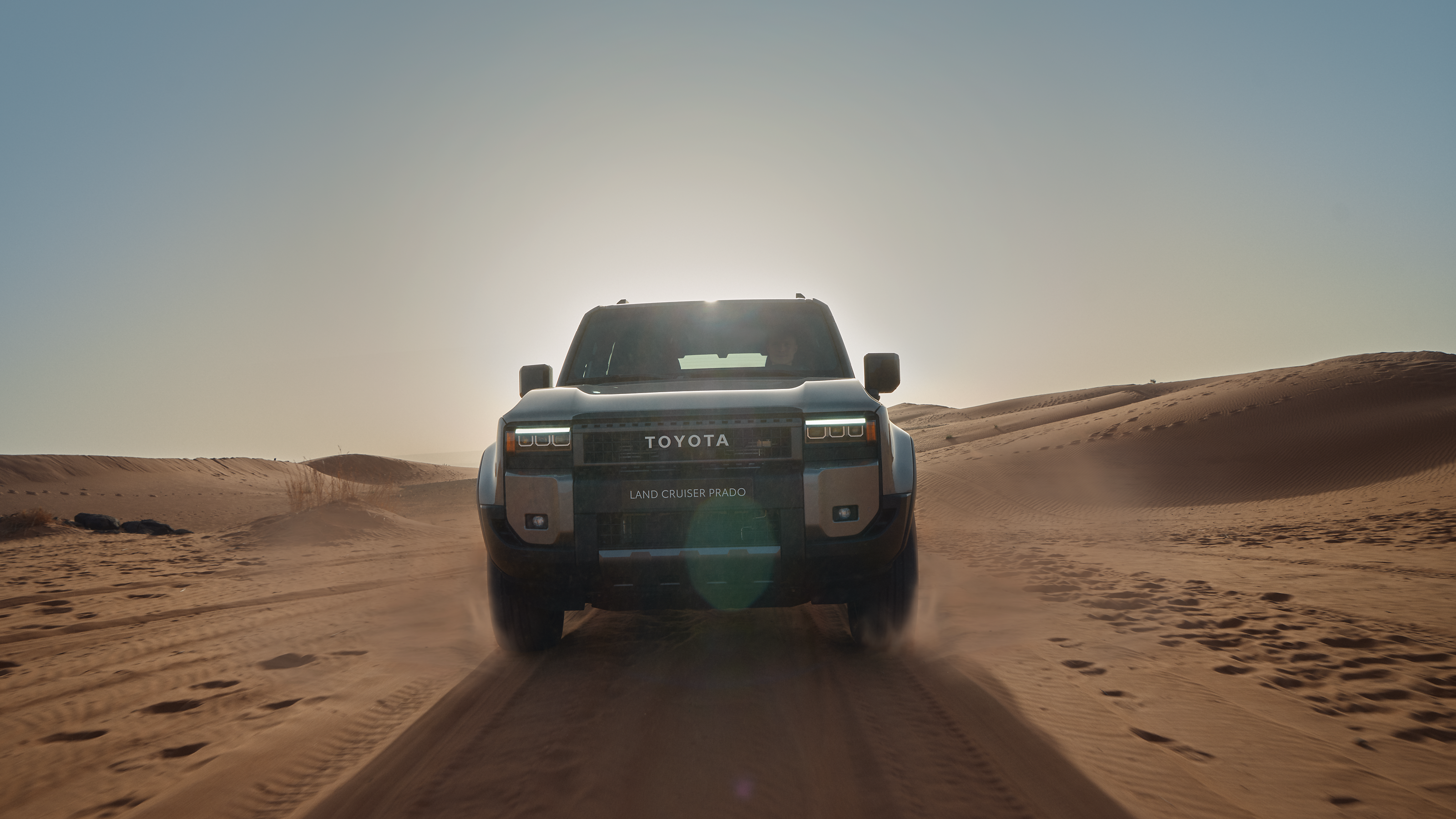 Land Cruiser showing side mouldings driving in sand dunes 