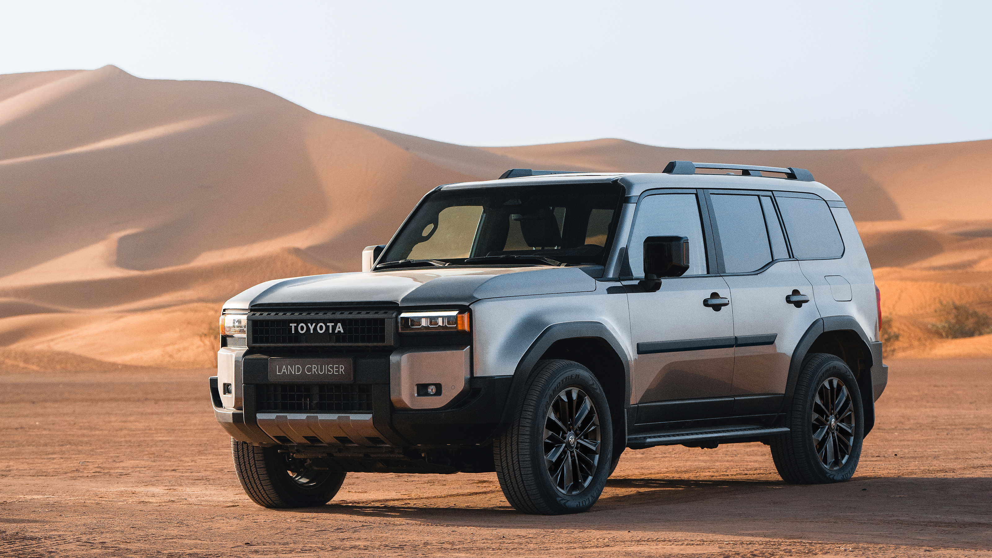 Land Cruiser showing side mouldings driving in sand dunes 