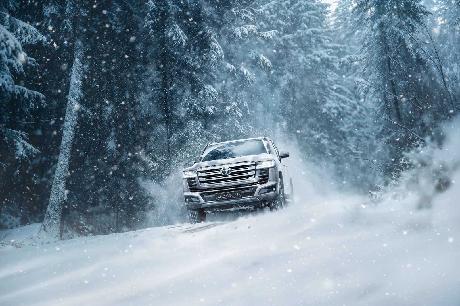 Land Cruiser 300 powering along and a snowy and icy trail.